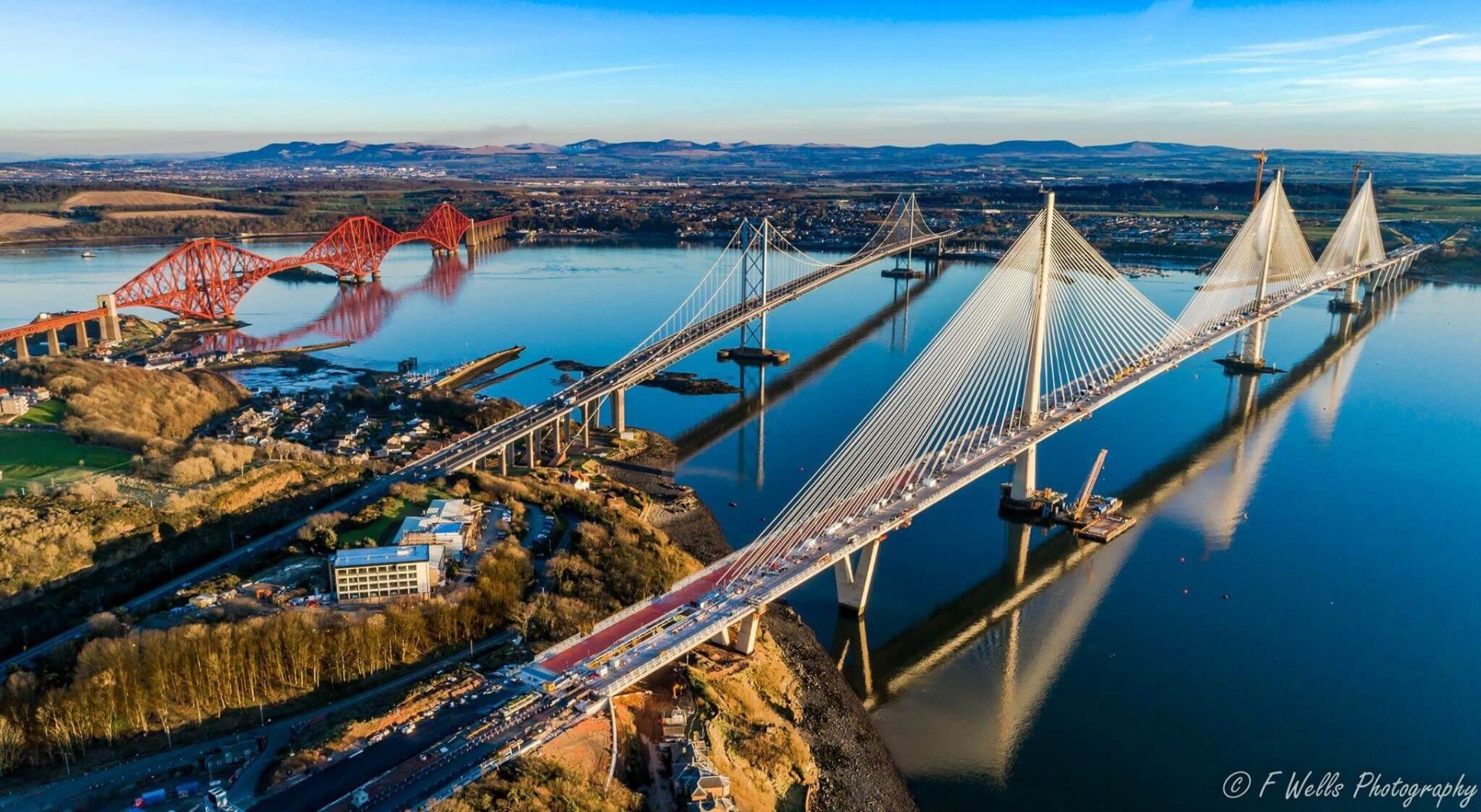 Aerial view showing the 3 bridges over the Forth - Queensferry Crossing, Forth Rail bridge