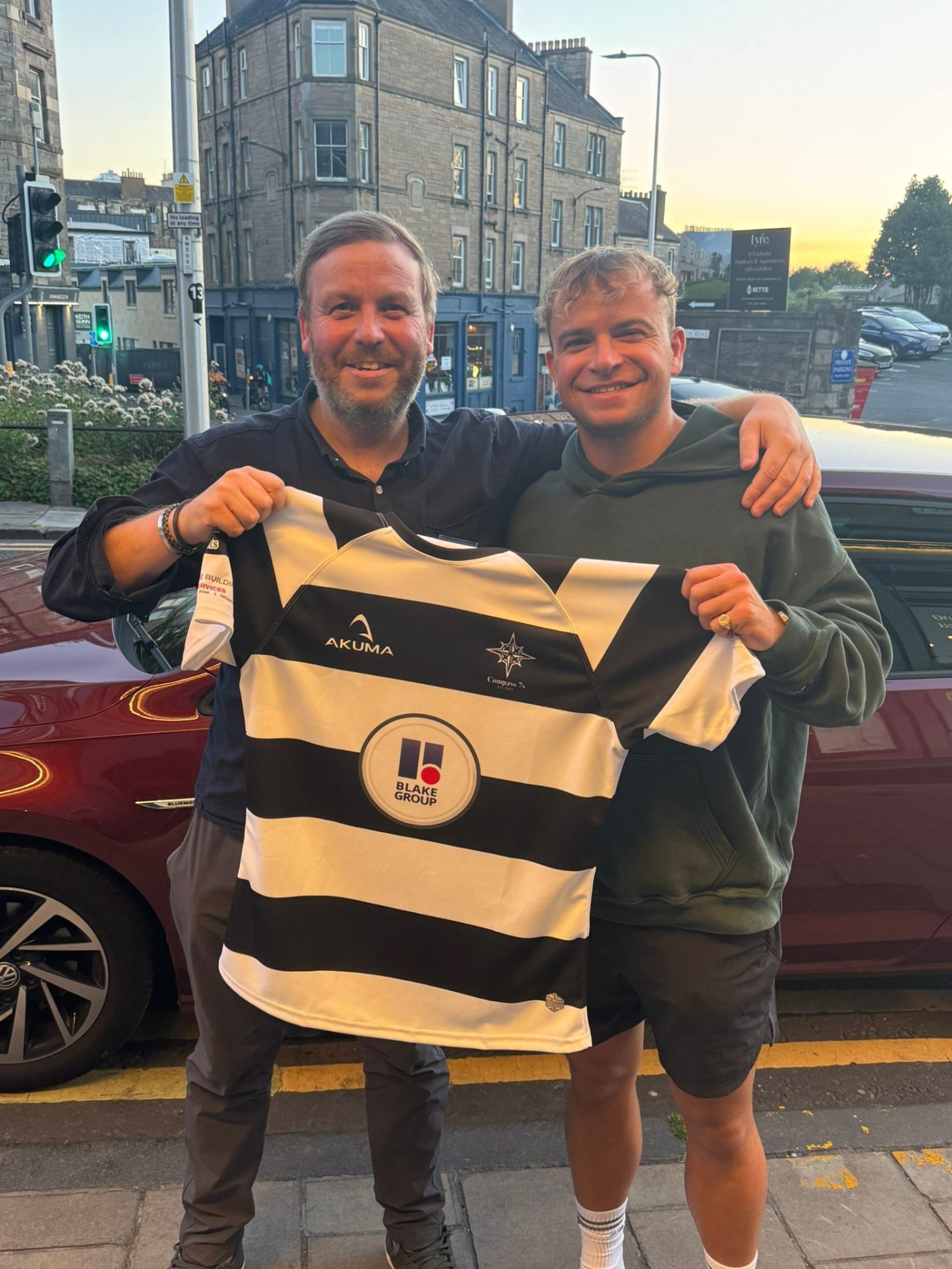 Blake Group are sponsors of Compass 7s Rugby Team. Photo with rugby shirt with logo