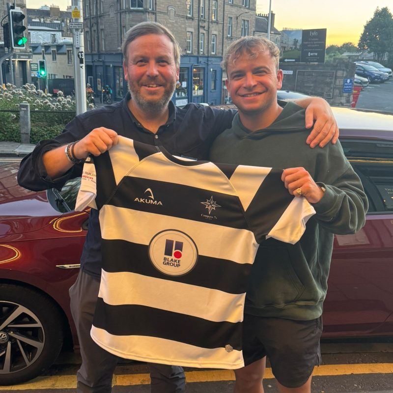 Blake Group are sponsors of Compass 7s Rugby Team. Photo with rugby shirt with logo