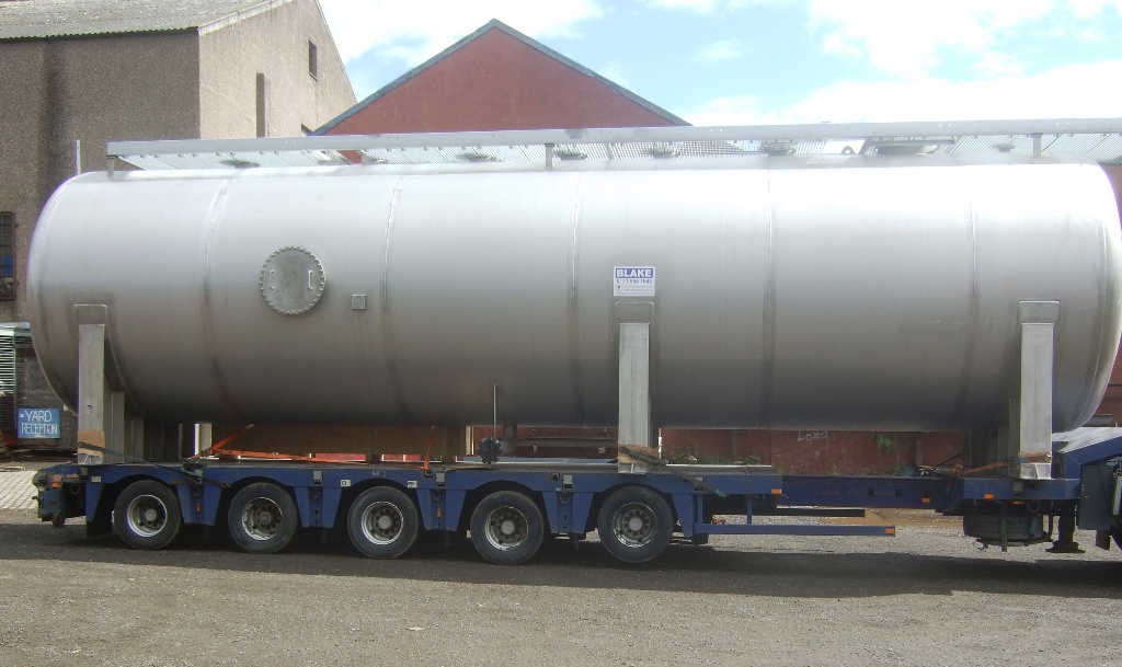 Large horizontal Cylindrical tank made by Blake Group on the back of a trailer for offshore use