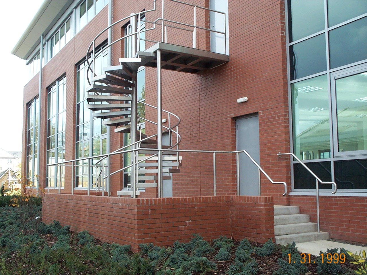 External spiral metal staircase by Blake Group