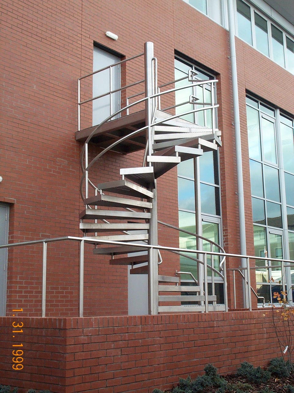 External spiral metal staircase by Blake Group