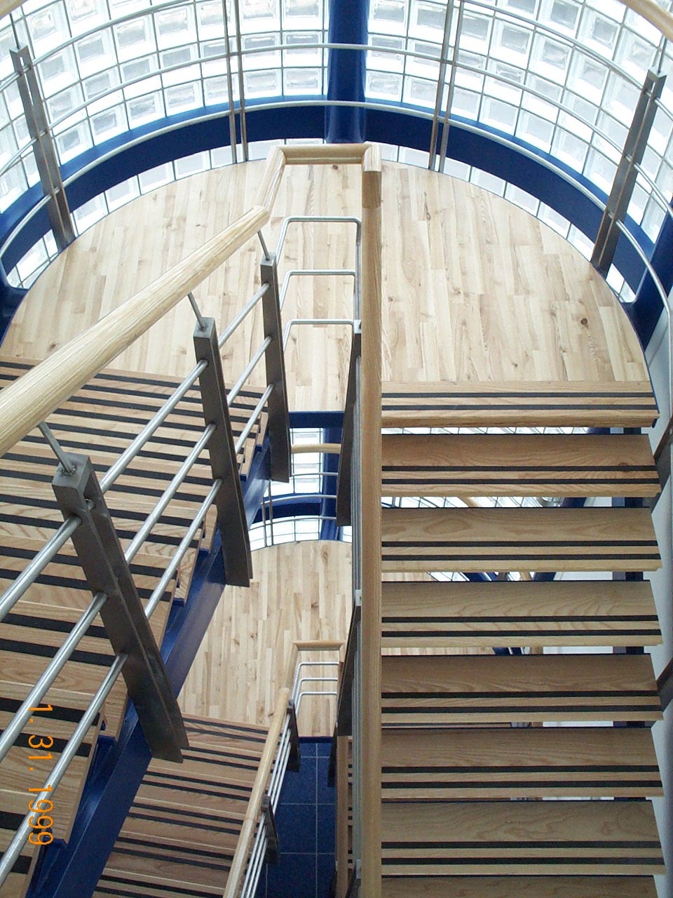 Internal staircase with metal and wood design by Blake Group