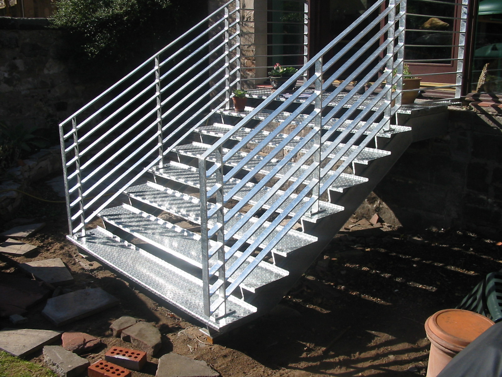 Front view of new external, shiny metal staircase made by Blake Group in Edinburgh